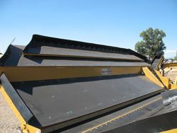 a close up of a conveyor belt on a tractor .