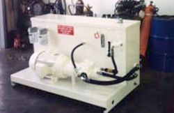 a white box with a motor and hose attached to it is sitting on a table in a room .