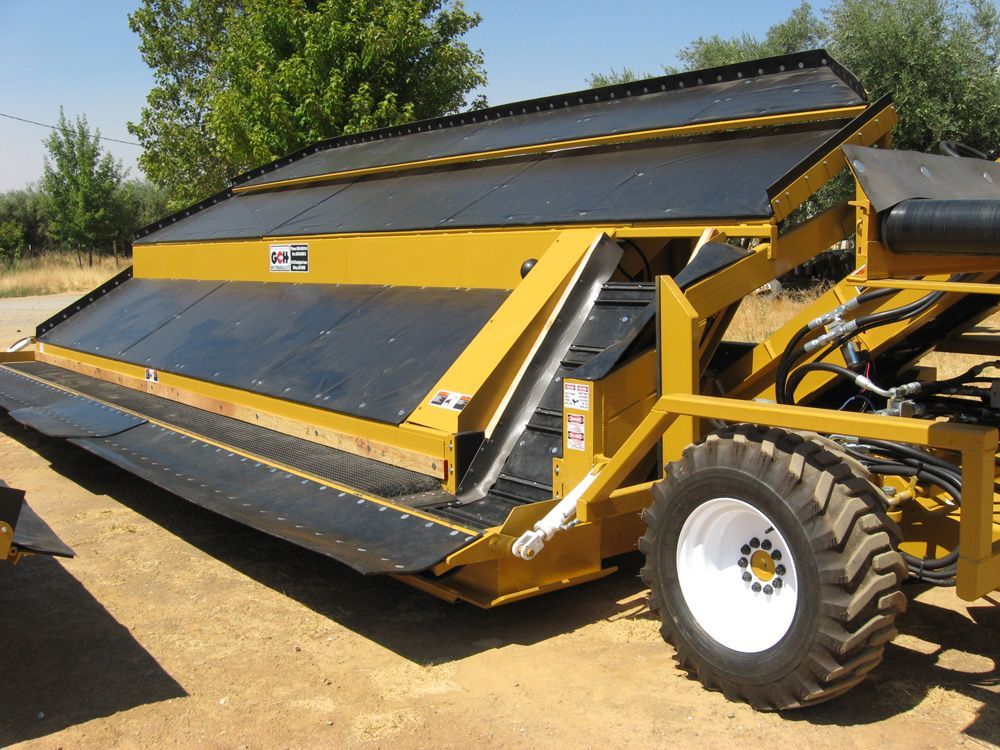 a yellow and black tractor with stairs on the side