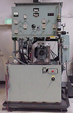 a machine with a green exit sign behind it