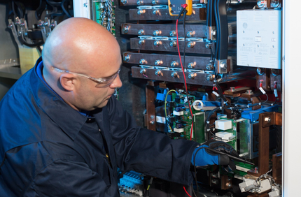 a ups technician repairing and maintaining a ups backup power system