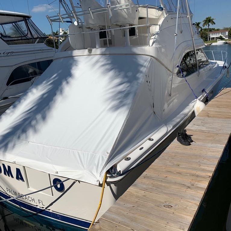A white boat with the name oma on the back