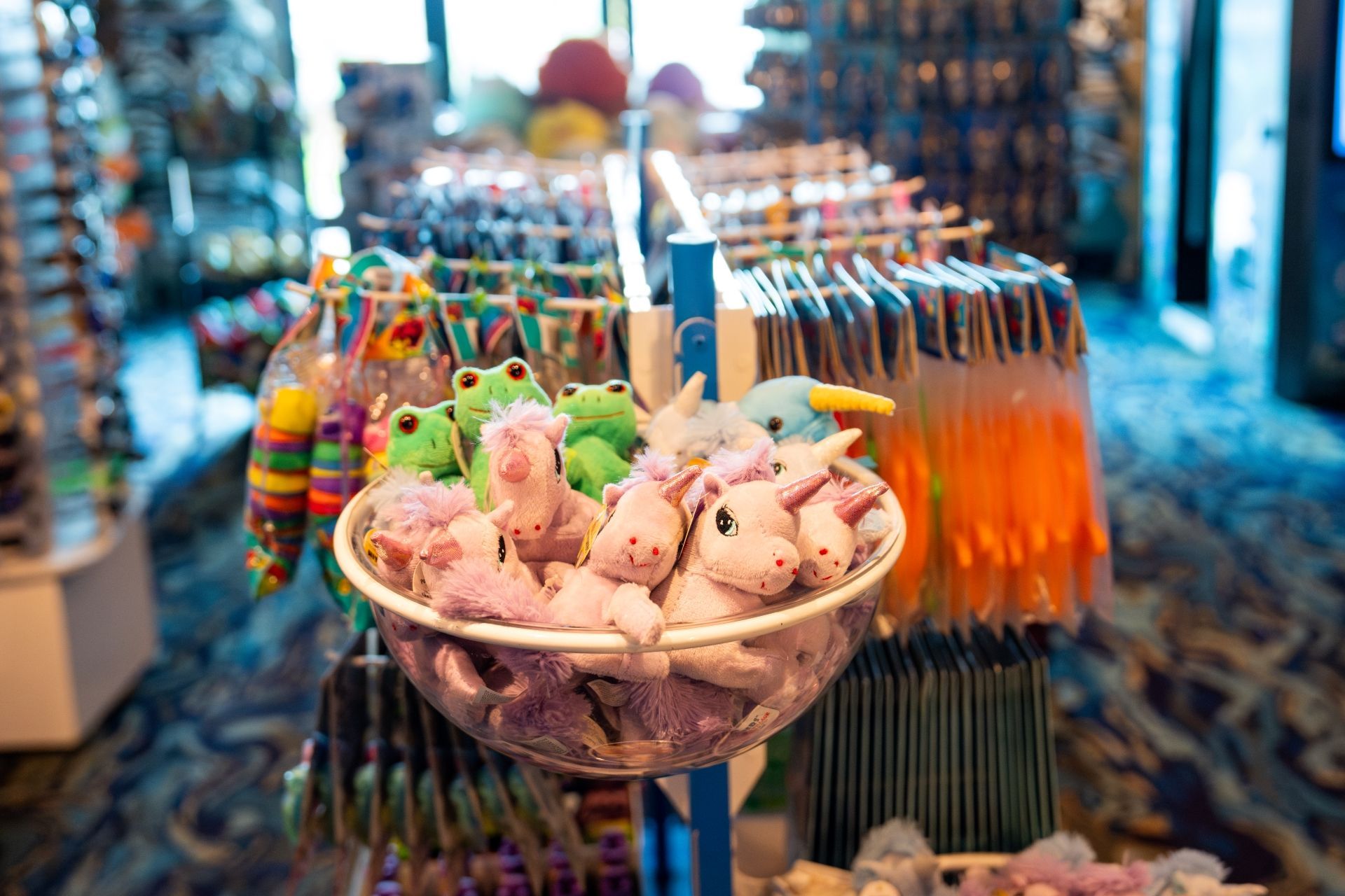A display of stuffed animals and frogs in a store