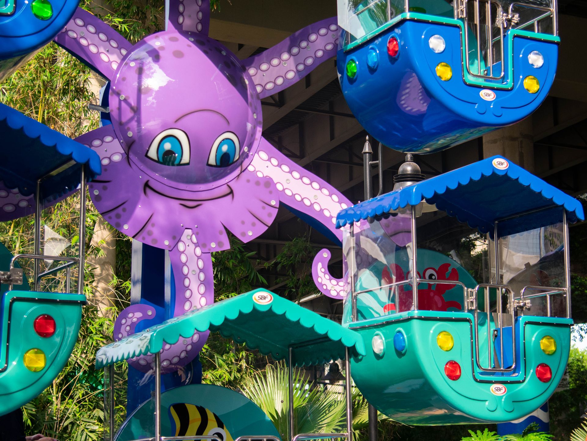 A ferris wheel with a purple octopus on it