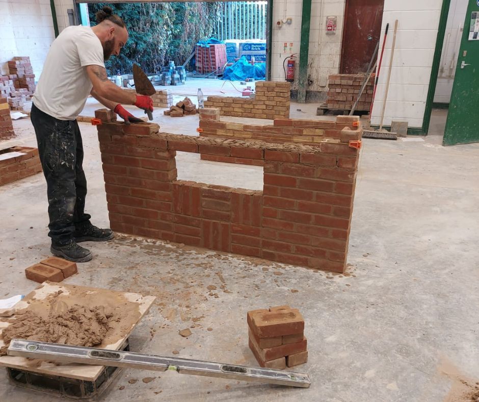Student mastering advanced bricklaying techniques during hands-on training at Chameleon Skills.