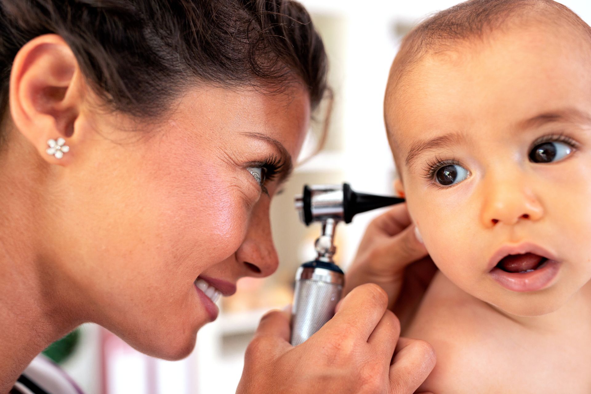 Baby getting examined by doctor