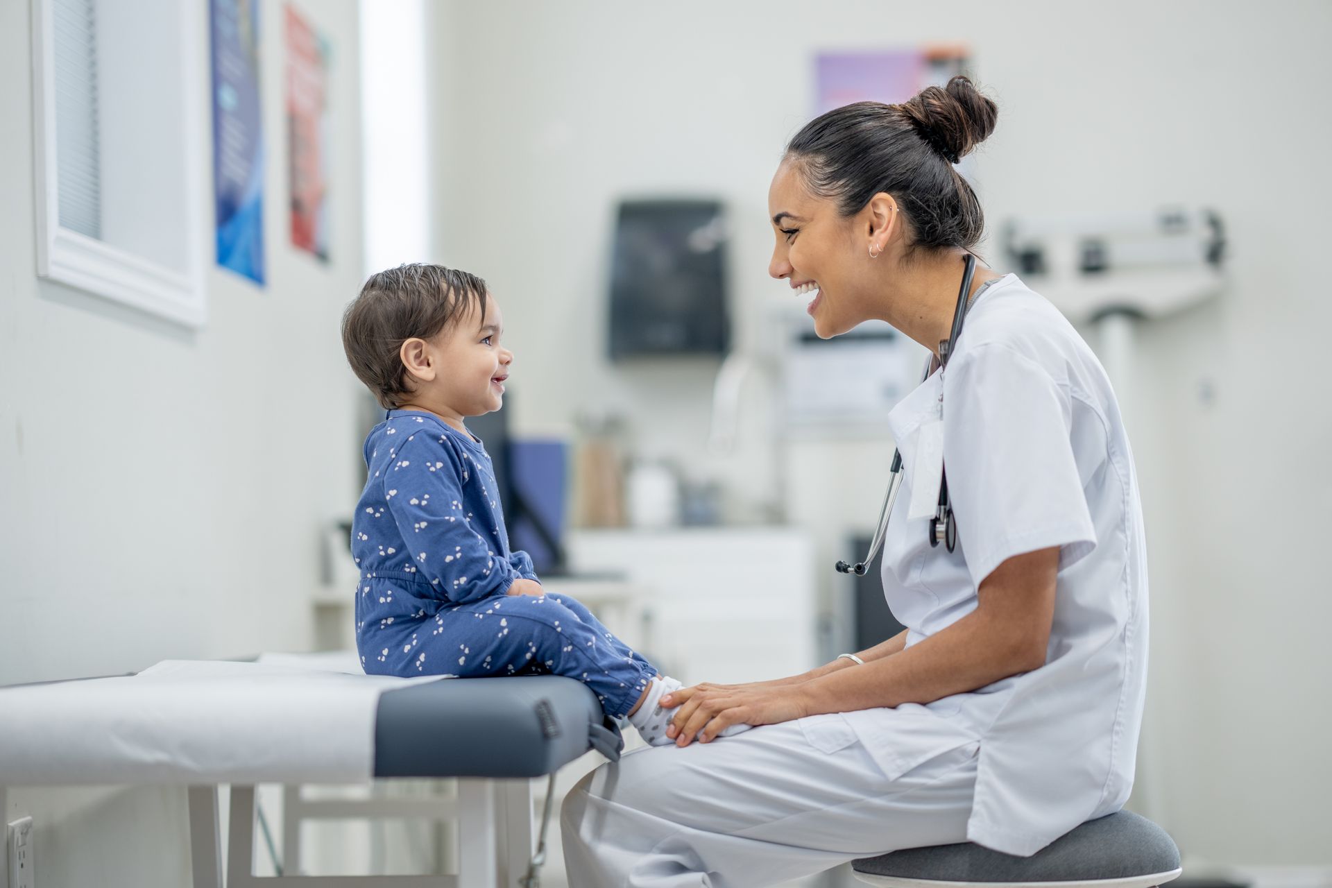 Baby getting examined by doctor