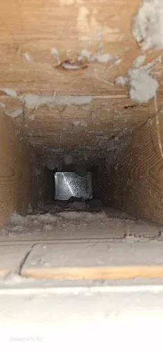 A close up of a hole in the ceiling of a building.