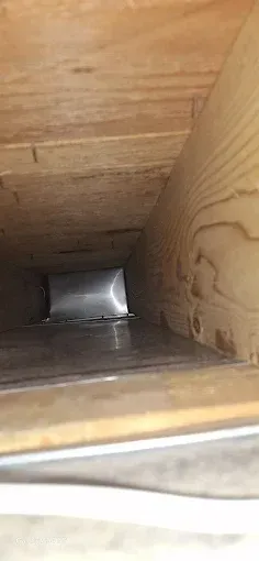 A close up of a piece of wood on a wooden floor.