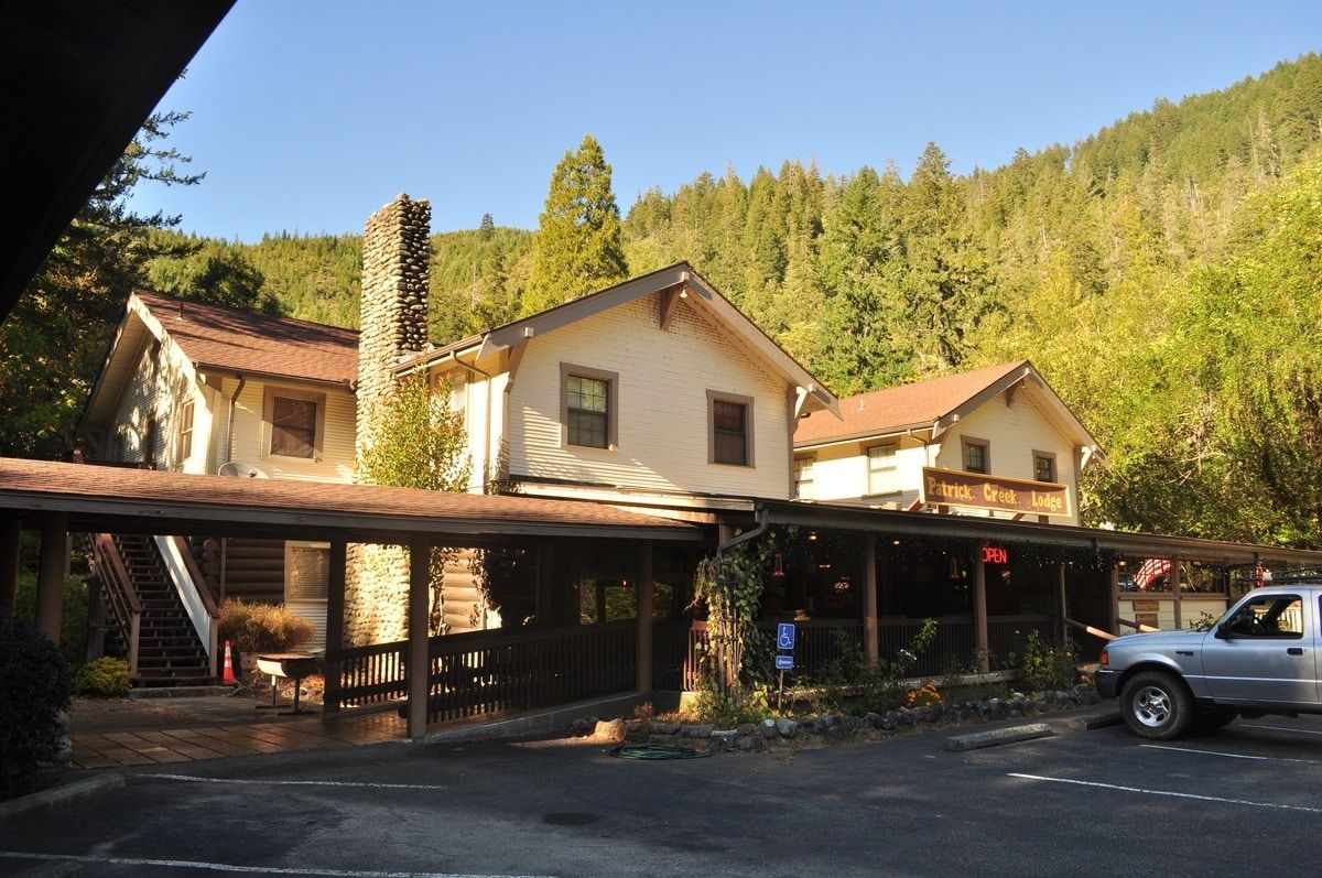 Exterior of lodge with porch and trees