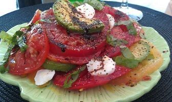 Caprese salad with tomatoes, mozzarella, and basil