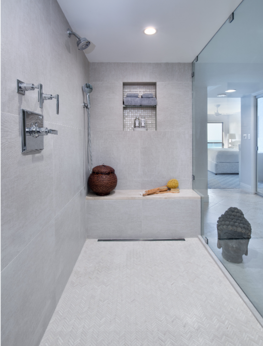 A bathroom with a walk in shower and a bathtub.