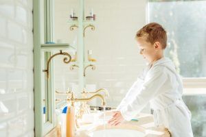 Showers — Young Boy Washing Hands in Naples, FL