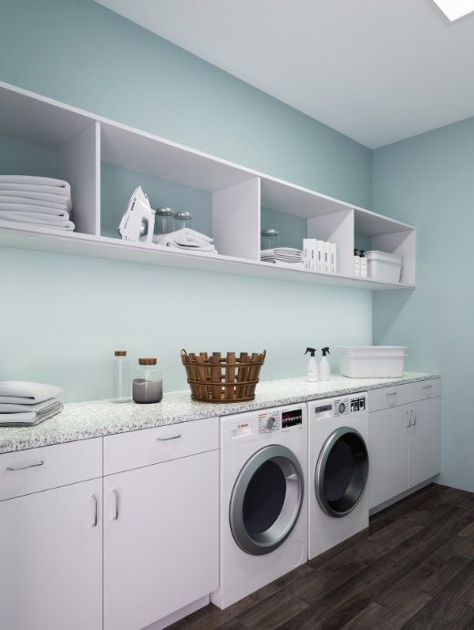 A laundry room with a washer and dryer and a basket on the counter — Naples, FL — Genuine Home Builders, Inc.