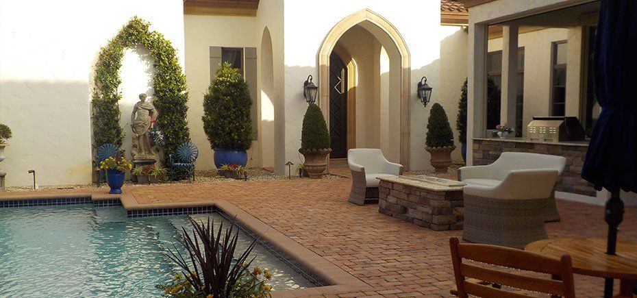 There is a swimming pool in the middle of the courtyard.