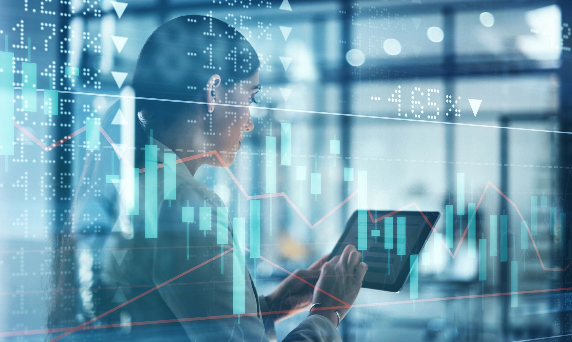 A Woman Is Looking At a Tablet With a Graph on It — Kansas City, MO — SD Smith Business Resource Consulting Firm