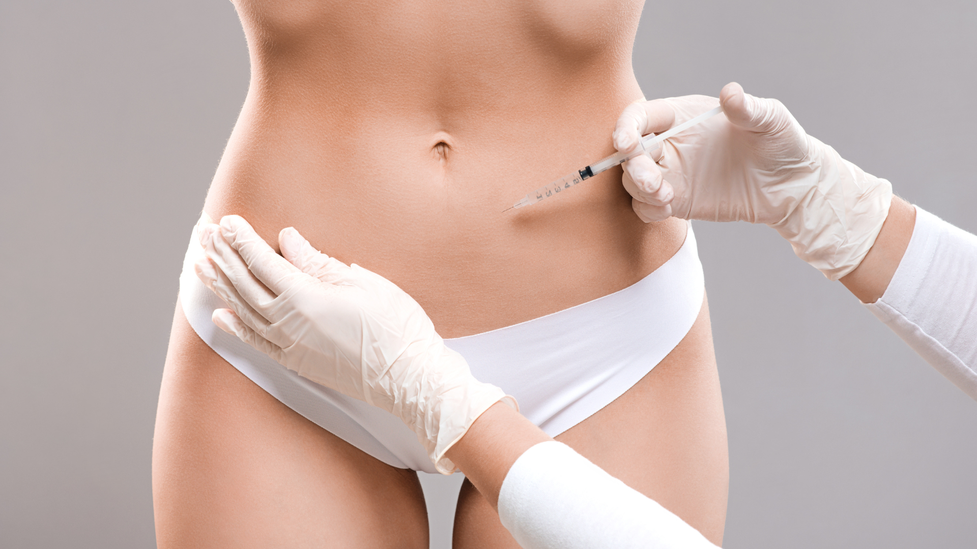 Woman getting injections on stomach