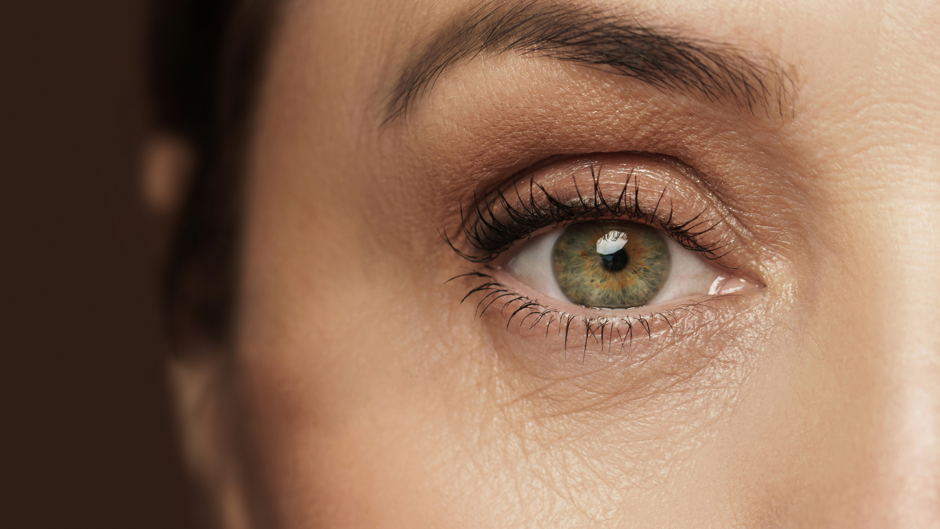 close up of woman's eye, highlighting skin texture
