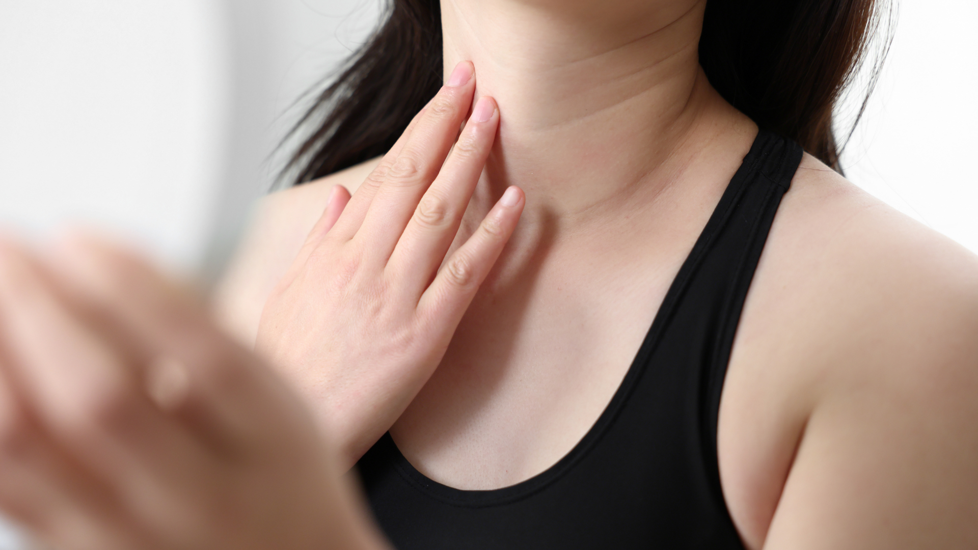 Woman worried about aging on her neck, contemplating PDO threads
