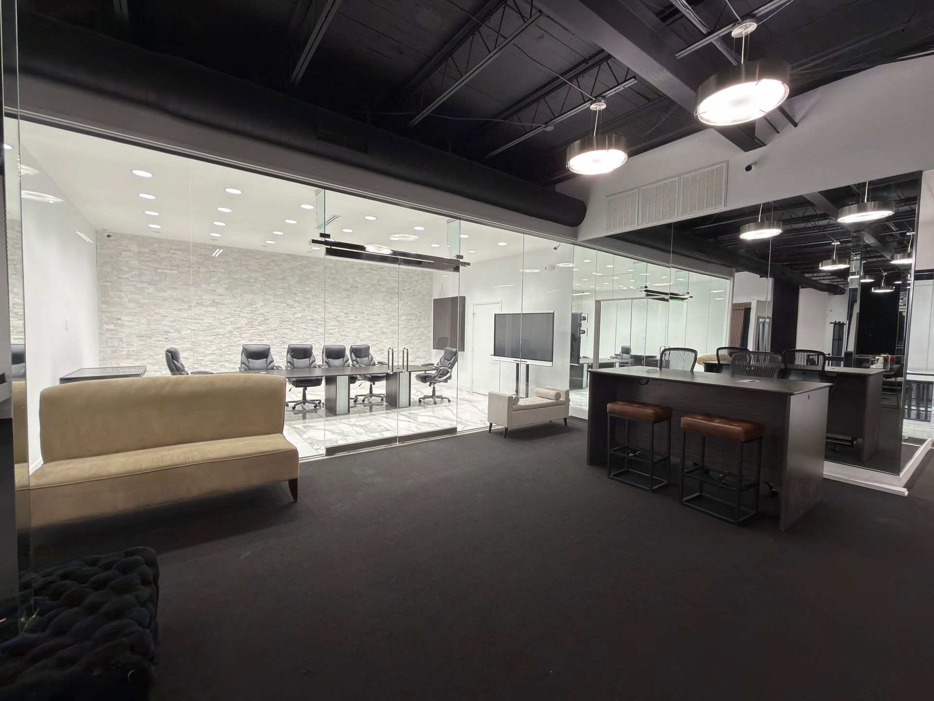 Classroom with rows of desks and burgundy chairs, white walls, and marble floors.