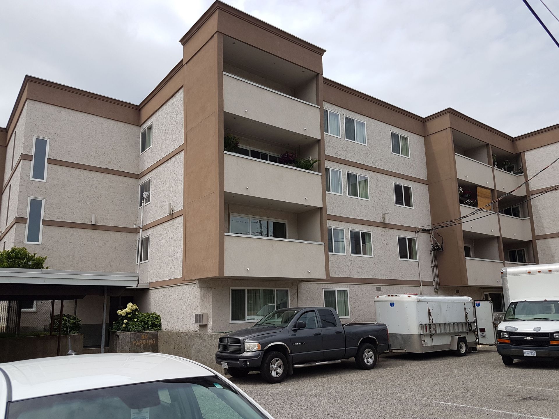 A building with a lot of cars parked in front of it