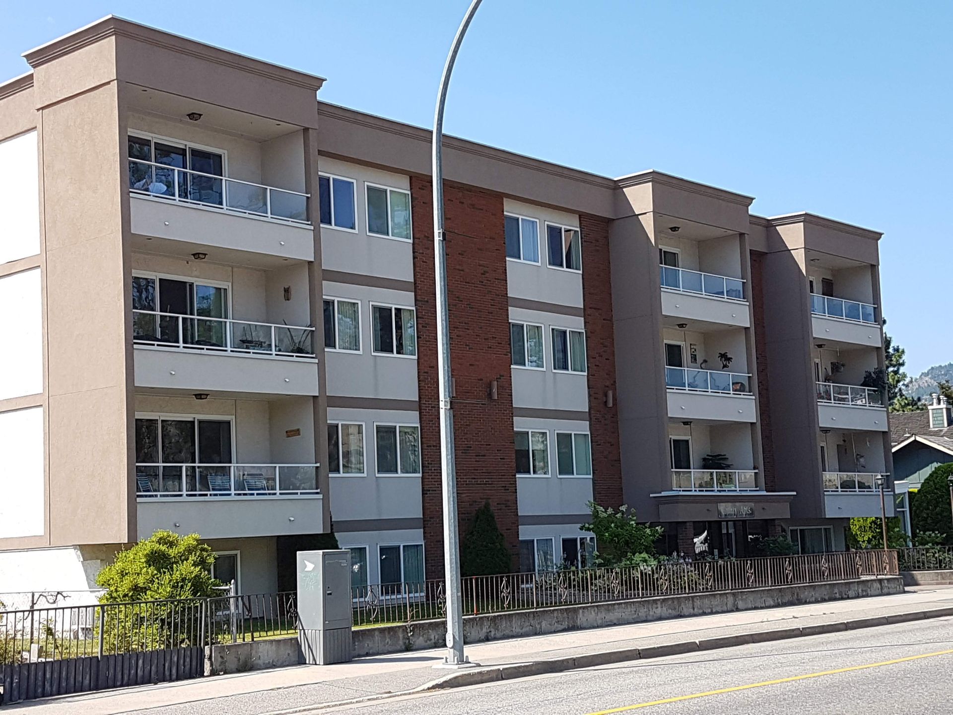 A large apartment building with a lot of windows and balconies