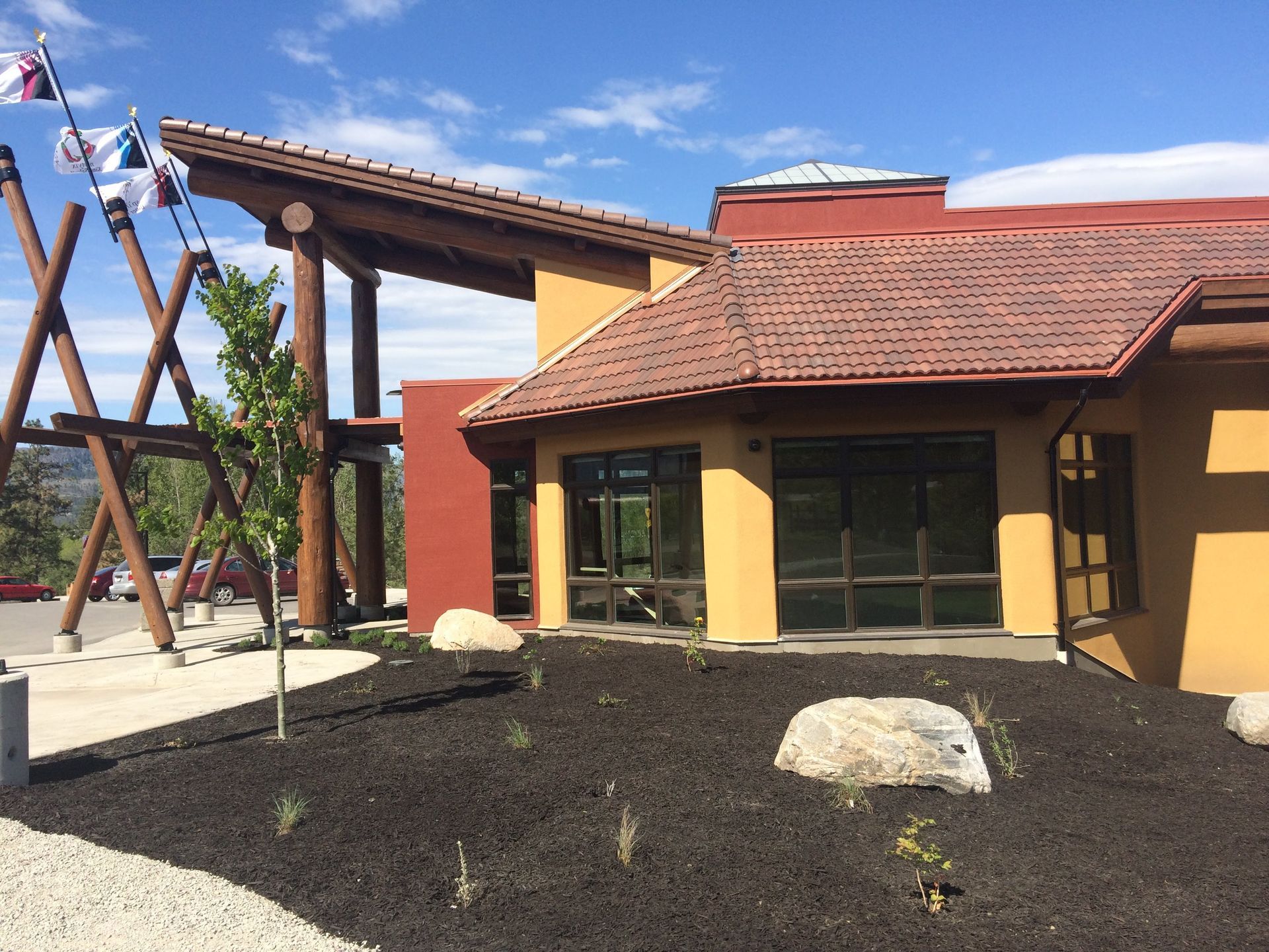 A building with a red tile roof and a lot of windows