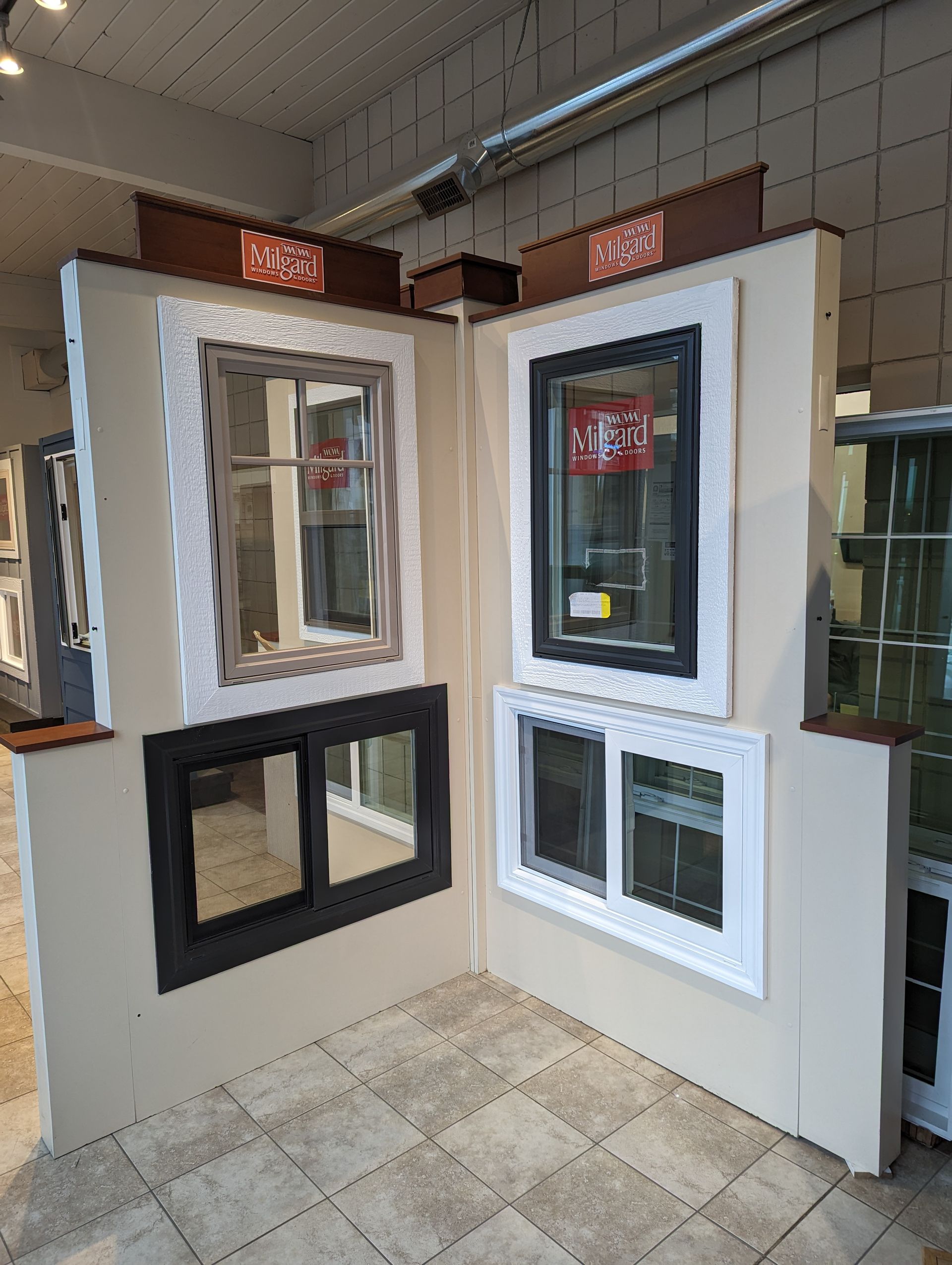 A room with a lot of windows and mirrors on the wall.