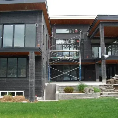 A large house with a scaffolding in front of it