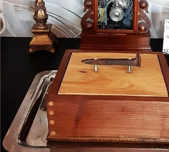 Wooden box with railroad spike handle