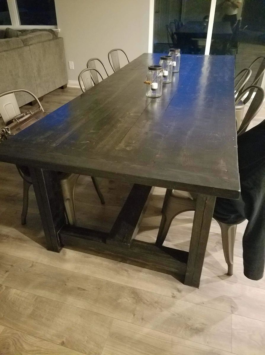 Dark wooden dining table with metal chairs