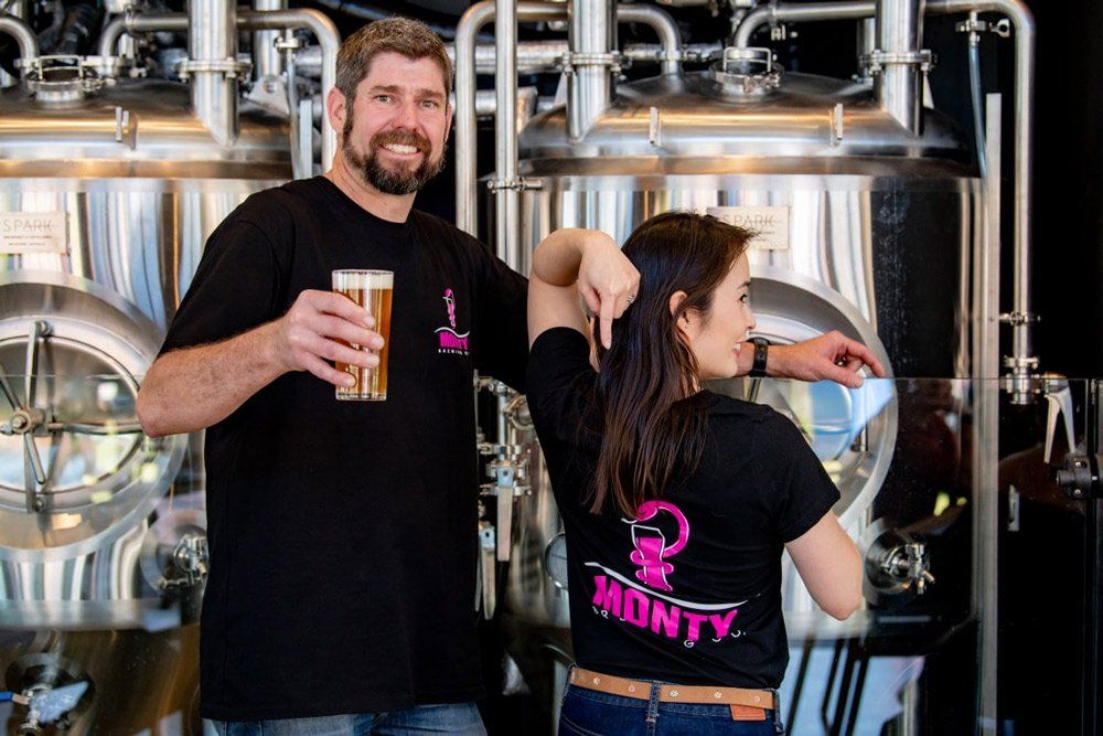 A Man and a Woman Are Standing Next to Each Other in a Brewery — Monty Brewing Co. In Highfields, QLD