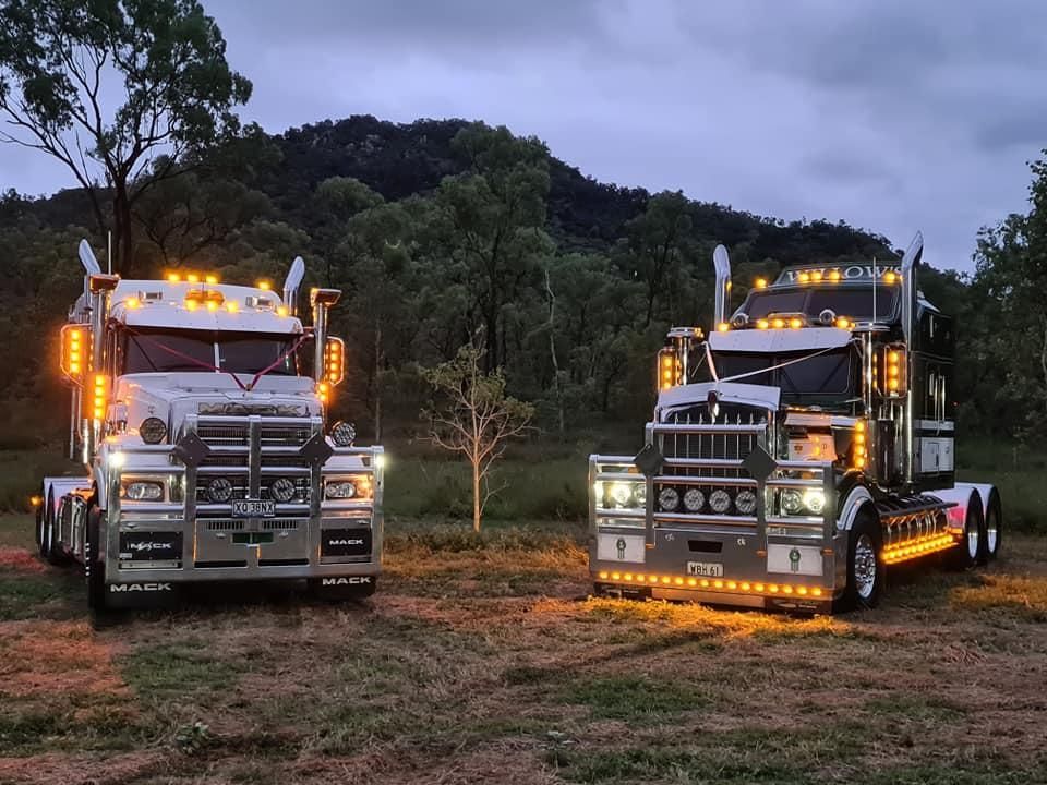 Two Semi Trucks Are Parked Next To Each Other In A Field — Willow's Bitumen Haulage Pty Ltd In South Australia