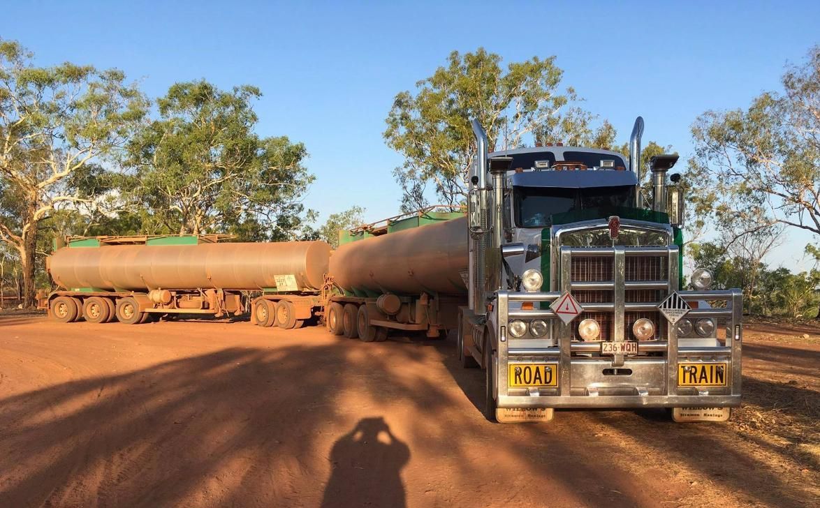 A Large Semi Truck Is Parked On A Dirt Road — Willow's Bitumen Haulage Pty Ltd In Queensland
