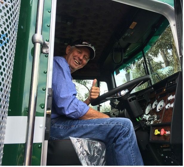 Three Men In Suits Are Standing Next To Each Other On A Stage — Willow's Bitumen Haulage Pty Ltd In Stuart, QLD