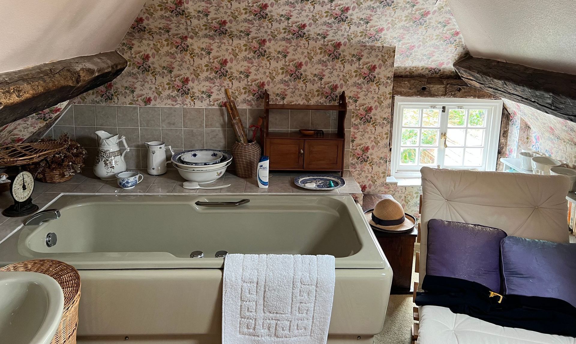 There is a bathtub in the middle of a bathroom.