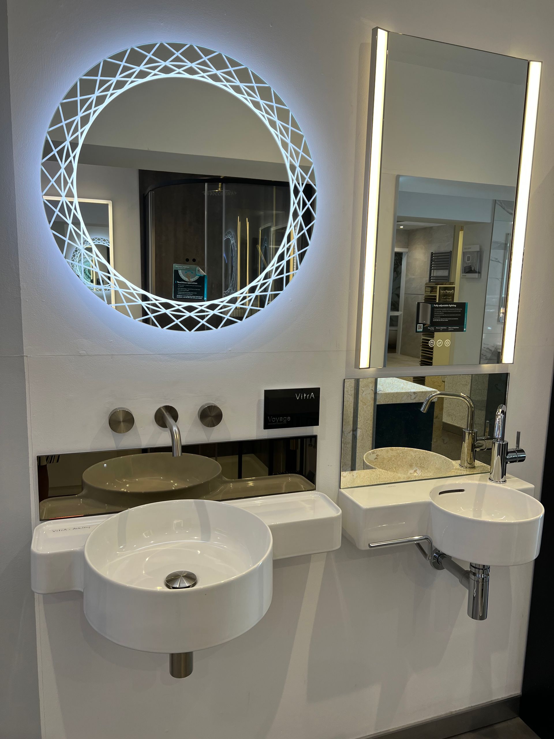 A bathroom with two sinks and a mirror