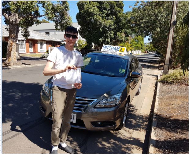 person in front of car