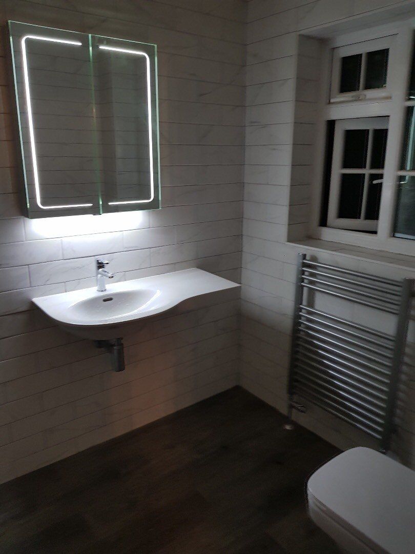 Bathroom with lighting below the mirror