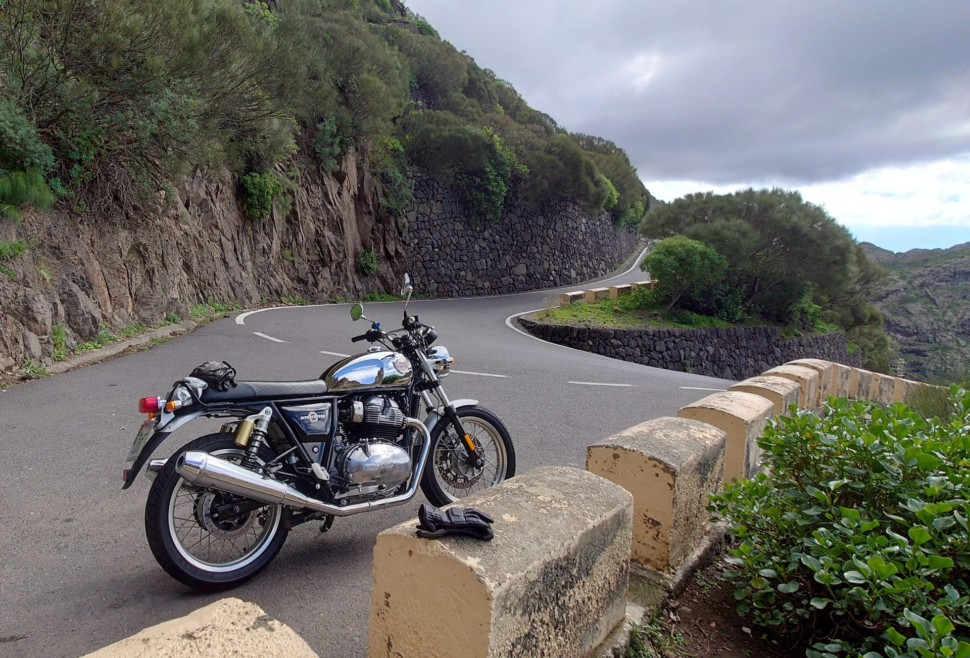 A motorcycle is parked on the side of a road.