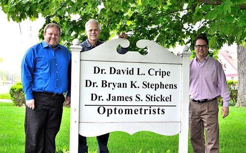 Cripe, Stephen and Stickel standing with their banner — Eye Exams in Goshen, IN
