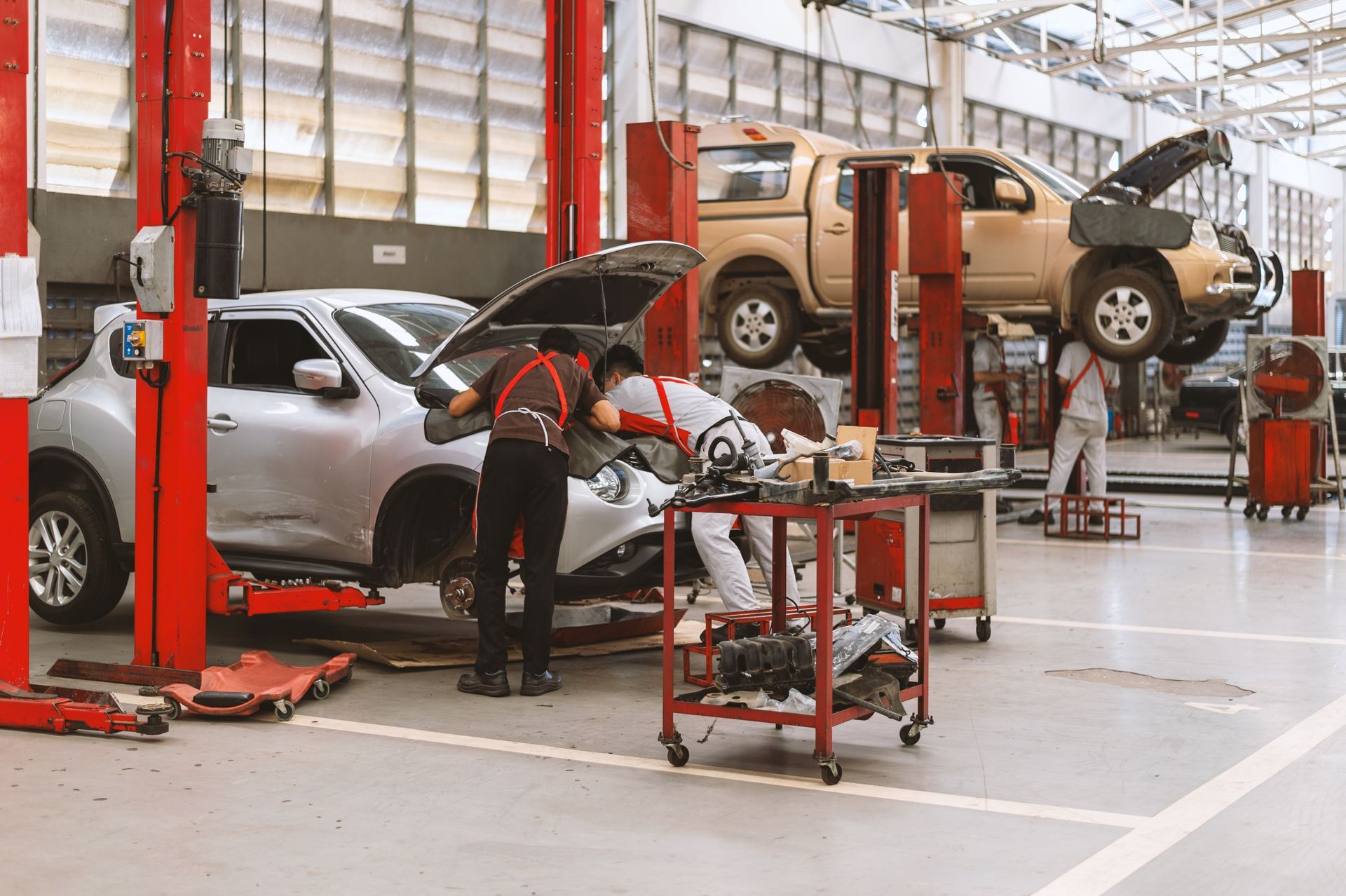 Interior of a car repair in garage service station with soft-focus and over light in the background