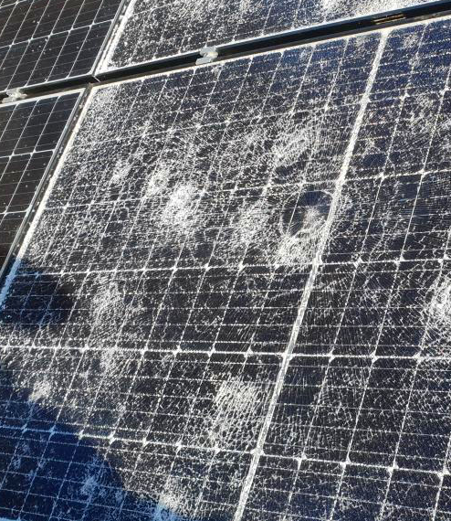 A close up of a solar panel with a lot of dust on it.