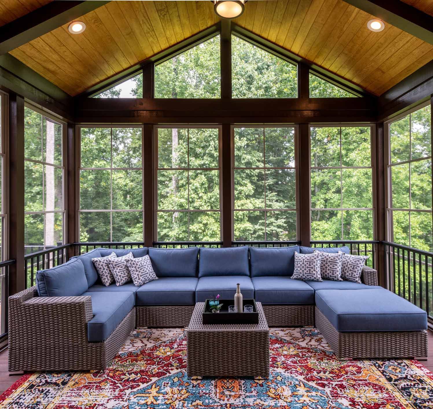 Screened Porch with a Blue Sofa and Coffee Table Screened Porch with a Blue Sofa and Coffee Table