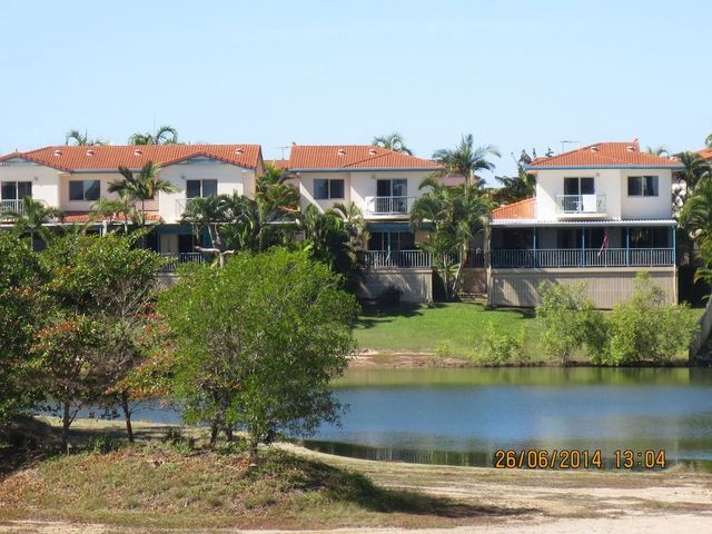 A row of houses next to a body of water