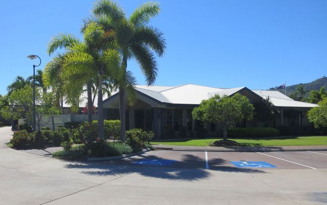A house with a handicapped parking spot in front of it