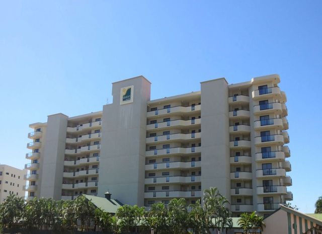 A large building with a bird on top of it