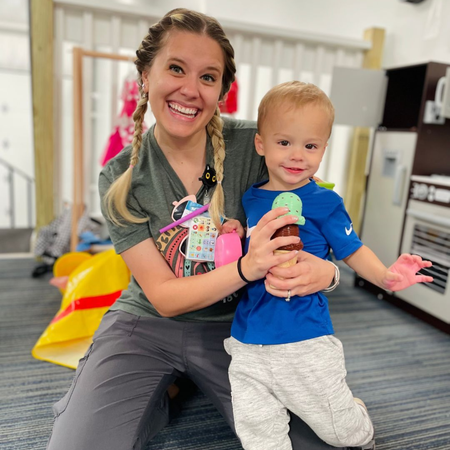 Pediatric speech therapist with child