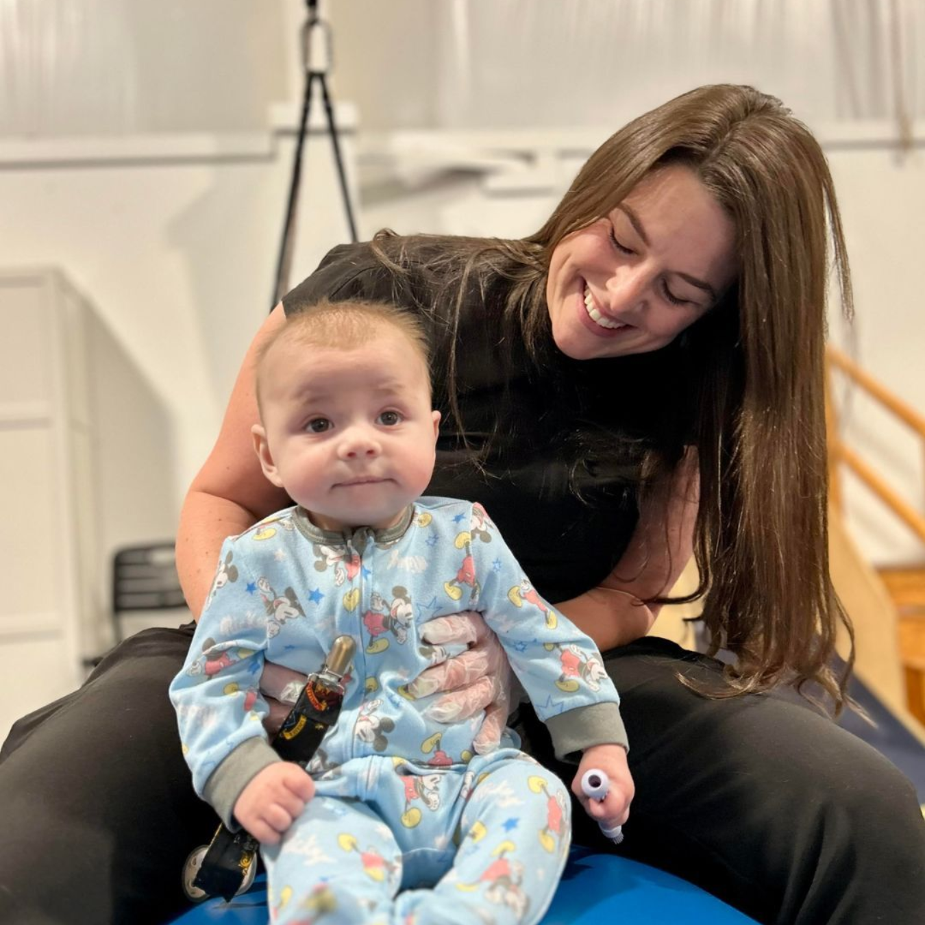 Pediatric Occupational therapist with Baby in Hogg Therapy Pediatrics Richmond Clinic