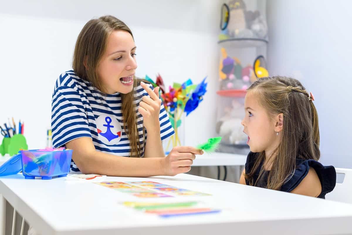 Speech language therapist teaching a child with autism in a clinic near Richmond, Kentucky (KY)